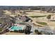 Beautiful aerial shot of the clubhouse, pool, and golf course, showcasing community amenities at 10620 S Ford Rd, Charlotte, NC 28214