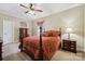 Comfortable bedroom with carpet, wooden furniture, and a cozy atmosphere at 10620 S Ford Rd, Charlotte, NC 28214