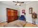 Cozy room with hardwood floors, large storage cabinet, and a comfortable reading area at 10620 S Ford Rd, Charlotte, NC 28214