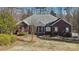 Charming brick home with well-maintained landscaping and a welcoming front entrance at 10620 S Ford Rd, Charlotte, NC 28214