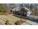 Inviting home with attached garage, complemented by a well-manicured lawn and mature trees at 10620 S Ford Rd, Charlotte, NC 28214