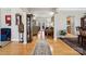 Elegant foyer featuring hardwood floors, decorative archways, and views into the living spaces at 10620 S Ford Rd, Charlotte, NC 28214