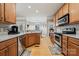 Well-equipped kitchen area with views of dining and stainless-steel appliances at 10620 S Ford Rd, Charlotte, NC 28214