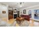 Living room features a fireplace, built-in bookcase, and access to the outdoor deck at 10620 S Ford Rd, Charlotte, NC 28214