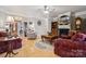Cozy living room with hardwood floors, fireplace, and comfortable seating arrangements at 10620 S Ford Rd, Charlotte, NC 28214