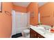 Bathroom featuring orange walls, single vanity, and shower-tub combo at 108 Berkshire Ave, Belmont, NC 28012