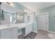 Bright bathroom featuring double vanity, ample storage, and a large mirror at 108 Berkshire Ave, Belmont, NC 28012