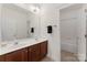 Well-lit bathroom with a double sink vanity and a separate toilet and shower area for added convenience at 108 Berkshire Ave, Belmont, NC 28012