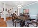 Formal dining room featuring a large table, chandelier, and elegant decor at 108 Berkshire Ave, Belmont, NC 28012