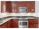 Gourmet kitchen featuring stainless steel appliances, granite countertops, and custom cabinetry at 108 Berkshire Ave, Belmont, NC 28012