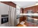Well equipped kitchen with stainless steel appliances, granite countertops, and ample counter space at 108 Berkshire Ave, Belmont, NC 28012