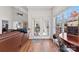 Bright living room featuring hardwood floors, french doors, large windows, and natural light at 108 Berkshire Ave, Belmont, NC 28012