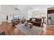 Spacious living room with vaulted ceilings, large windows, hardwood floors, and comfortable seating at 108 Berkshire Ave, Belmont, NC 28012