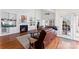 Bright living room featuring a fireplace, built-in shelving, and large windows at 108 Berkshire Ave, Belmont, NC 28012