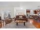 Open living room connected to the kitchen featuring hardwood floors, comfortable seating, and natural light at 108 Berkshire Ave, Belmont, NC 28012