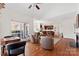 Open-concept living area with hardwood floors, comfortable seating, and views into the kitchen at 108 Berkshire Ave, Belmont, NC 28012