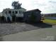 Exterior of home with a shed, stairs, a deck and an easy access lift at 111 Scenic Ln, New London, NC 28127