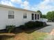 The exterior of home featuring neat landscaping, with well-maintained siding and trim at 111 Scenic Ln, New London, NC 28127