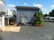 The exterior of shed featuring double doors and a small window at 111 Scenic Ln, New London, NC 28127
