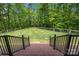 Brick steps lead to a fenced-in, grassy backyard, offering privacy and space for recreation at 11280 Mcfalls Dr, Fort Mill, SC 29707