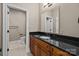 Traditional-style bathroom offering vanity with granite countertop and a separate toilet area at 11280 Mcfalls Dr, Fort Mill, SC 29707