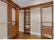 A spacious closet with custom wood shelving and ample storage for clothes, shoes, and accessories at 11280 Mcfalls Dr, Fort Mill, SC 29707