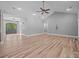 Bright, open living room with high ceilings and hardwood floors, bathed in natural light at 11280 Mcfalls Dr, Fort Mill, SC 29707