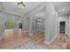Open concept living space with hardwood floors, neutral paint, elegant trim, and architectural columns at 11280 Mcfalls Dr, Fort Mill, SC 29707