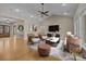 Inviting living room with vaulted ceilings, comfortable seating, and stylish decor at 11280 Mcfalls Dr, Fort Mill, SC 29707
