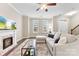 Inviting living space with a fireplace, a neutral sectional sofa, and natural light, perfect for relaxation and entertaining at 1300 Assembly St, Belmont, NC 28012