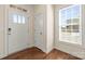 Bright foyer with a window, a solid wood door, and hardwood flooring at 13203 Caite Ridge Rd, Davidson, NC 28036