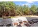 Spacious backyard featuring a patio, gravel, walkways and fence around the back of the property at 1485 Sierra Rd, York, SC 29745