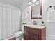 Bathroom with single sink, a decorative mirror, and a toilet and shower at 1485 Sierra Rd, York, SC 29745