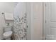 Cozy bathroom with white toilet and shower featuring a botanical curtain at 1485 Sierra Rd, York, SC 29745