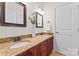 Bathroom boasts double sinks, granite counters, and dark wood cabinets at 1485 Sierra Rd, York, SC 29745