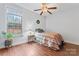 Bright bedroom with hardwood floors, large window and neutral color palette at 1485 Sierra Rd, York, SC 29745