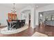 Spacious dining room with hardwood floors, elegant chandelier, and seamless flow to other living areas at 1485 Sierra Rd, York, SC 29745