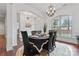 Elegant dining room features a chandelier, hardwood floors, and seamless flow to other living areas at 1485 Sierra Rd, York, SC 29745