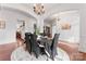 Elegant dining room featuring hardwood floors, chandelier, and seamless flow to other living areas at 1485 Sierra Rd, York, SC 29745