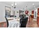 Bright dining room with wood floors and a kitchen view through the doorway at 1485 Sierra Rd, York, SC 29745