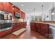 Open kitchen with stainless steel appliances, dark wood cabinets, and tile backsplash at 1485 Sierra Rd, York, SC 29745