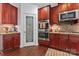 Gourmet kitchen with stainless steel oven, granite counters, and stylish cabinets at 1485 Sierra Rd, York, SC 29745