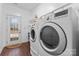 Laundry area with large washer and dryer and an exterior door at 1485 Sierra Rd, York, SC 29745