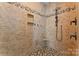 Tiled shower featuring a bench, multiple shower heads, and mosaic floor tiles at 1485 Sierra Rd, York, SC 29745