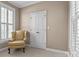 Cozy bedroom nook with a chair, natural light, and neutral wall color at 150 Canopy Oak Ln, Statesville, NC 28625