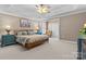 Inviting bedroom with a comfortable bed, neutral carpet, and plenty of natural light at 150 Canopy Oak Ln, Statesville, NC 28625