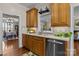 Traditional-style kitchen featuring wood cabinets, stainless steel appliances and an undermounted sink at 150 Canopy Oak Ln, Statesville, NC 28625