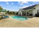 Private backyard pool with comfortable lounge chairs and dining table offers a perfect space for outdoor relaxation at 150 Canopy Oak Ln, Statesville, NC 28625