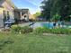 Enjoy this beautiful in-ground pool with black fencing, lovely landscaping, and an outdoor patio for entertaining at 150 Canopy Oak Ln, Statesville, NC 28625