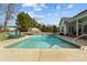 Backyard featuring a private in-ground pool, perfect for hot summer days, surrounded by lounge chairs at 150 Canopy Oak Ln, Statesville, NC 28625